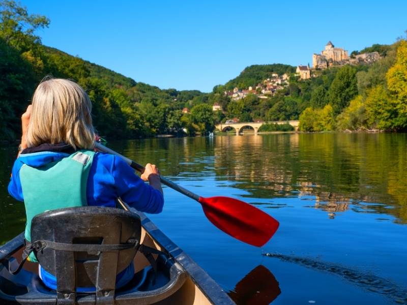 Domme France, View of Beynac while canoeing in the Dordogne River