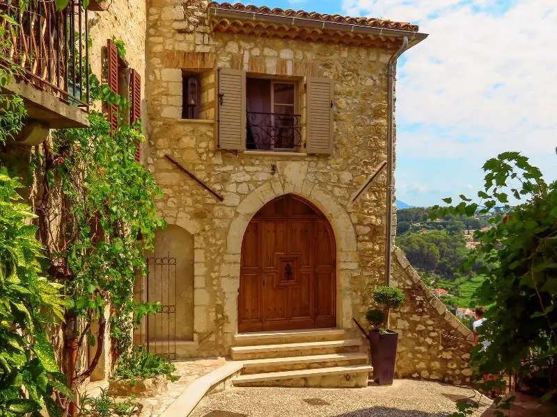 Saint-Paul-de-Vence France, An elegant house with wooden door, walls with vines, scenic views