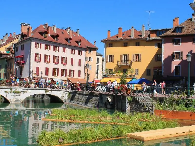 Annecy France, The vibrant pastel-colored houses and tourists